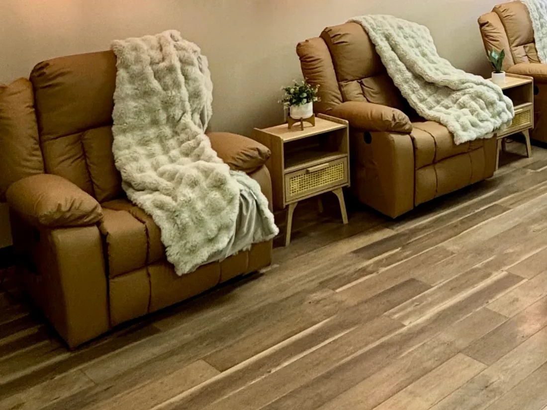 IV therapy lounge at LushRX Aesthetics with leather recliners and cozy blankets